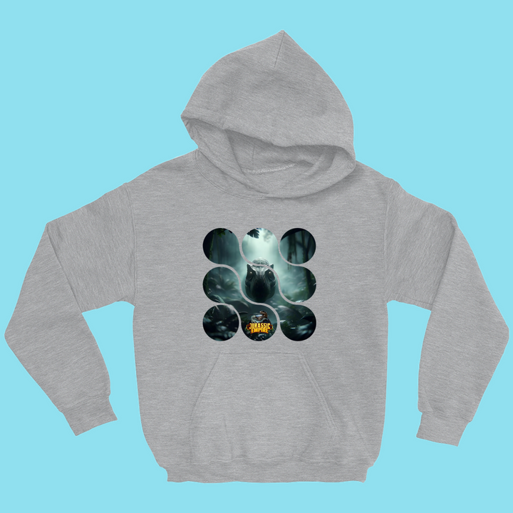 The Kids Jurassic Empire T-Rex Hoodie by Jurassic Studio features a gray design with a T-Rex in a misty forest, encircled by rings. Inspired by the classic Kids Jurassic T-Rex Hoodie, it has a solid light blue background—a unique find for dino fans.
