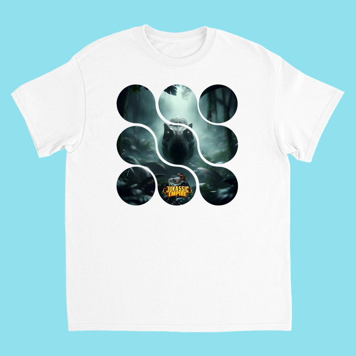 The Kids Jurassic Empire T-Rex T-Shirt by Jurassic Studio features a circular cutout with a dinosaur in a misty jungle and the classic Jurassic Park logo at the bottom, all on a fresh light blue background.