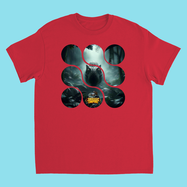 The Kids Jurassic Empire T-Rex T-Shirt by Jurassic Studio features a dinosaur in a jungle with circular cut-outs and the Jurassic Park logo at the bottom center, all on a light blue background.