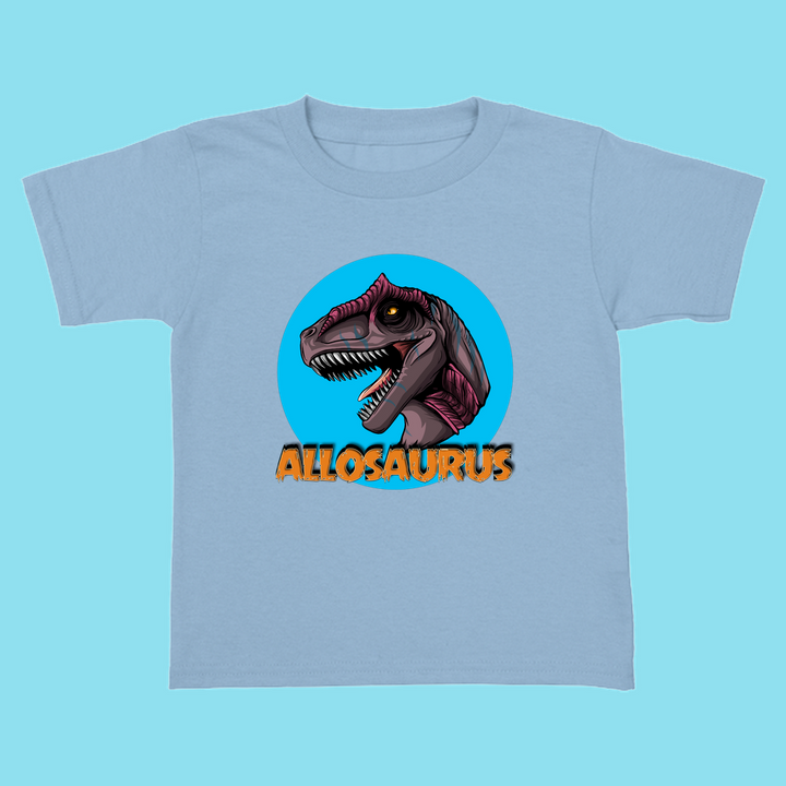 The Toddler Allosaurus Head T-Shirt by Jurassic Studio features a cartoon purple Allosaurus in a blue circle with “ALLOSAURUS” in bold orange—an ideal gift for young dinosaur fans!.