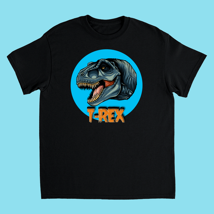Jurassic Studios Kids T-Rex Head T-Shirt features a fierce illustrated T-Rex in a blue circle with bold orange T-REX text on a light blue background—perfect for dinosaur fans and available exclusively from Jurassic Studio.