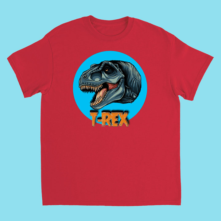 The Kids T-Rex Head T-Shirt by Jurassic Studio features an illustrated T-Rex in a blue circle with bold orange T-REX lettering—an exclusive design and perfect gift for dinosaur fans.