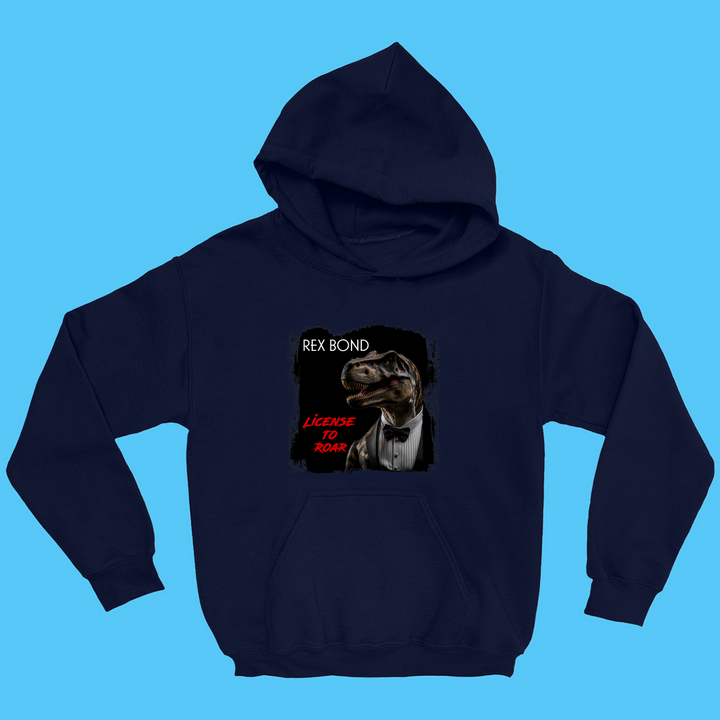 The Kids Rex Bond Hoodie by Jurassic Studio features a T. rex in a tuxedo, styled like James Bond, with Rex Bond and License to Roar text—a fun navy blue gift for dinosaur fans!.