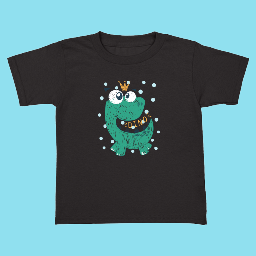The Jurassic Studio Toddler Baby Green Dino T-Shirt features a cute green cartoon dinosaur with a crown and DINO sign, white dots, and a light blue background. Made from 100% cotton—perfect gift for little dinosaur fans!.