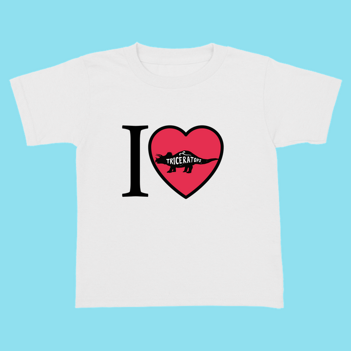 The Toddler I Love Triceratops T-Shirt by Jurassic Studio features a white tee with “I ♥ Triceratops” and a dino silhouette in the heart—a cute choice for little dino fans.