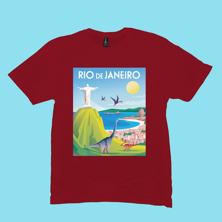 Jurassic Studio Men Rio de Janeiro T-Shirt features a vibrant scene of Christ the Redeemer, Sugarloaf, beach, city, dinosaurs, and pterosaurs under a sunny sky. Great gift for dino fans and a Jurassic Studio exclusive!.