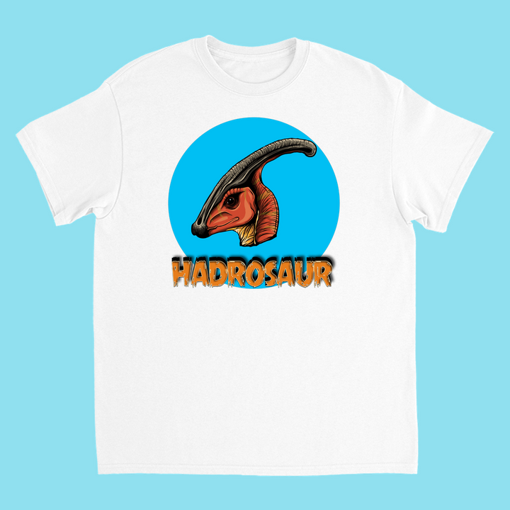 The Kids Hadrosaur Head T-Shirt by Jurassic Studio features a hadrosaur dinosaur head in a blue circle with HADROSAUR in bold orange and black below—perfect for dino fans or as a fun gift.