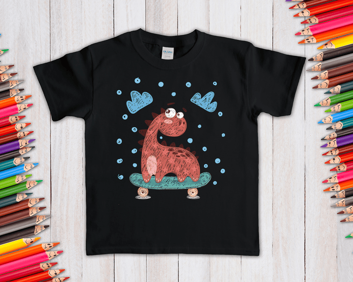 The Kids Baby Dino Skate T-Shirt by Jurassic Studio is a black tee with a cartoon red dino on a skateboard, blue dots, and clouds. Colored pencils border the design for a playful look—perfect for little skaters!.