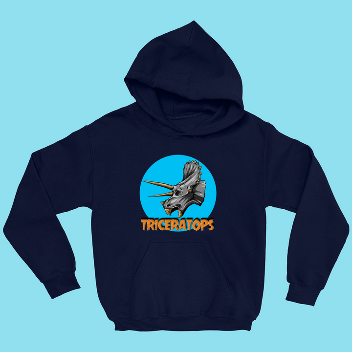 The Kids Triceratops Head Hoodie by Jurassic Studio features a realistic triceratops design in a blue circle with bold orange TRICERATOPS text, shown laid flat on a light blue background.