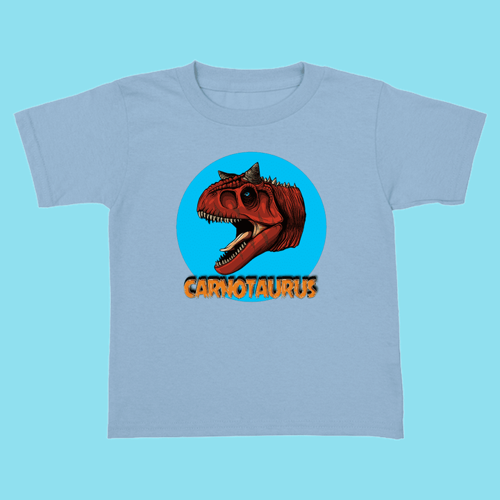 The Toddler Carnotaurus Head T-Shirt by Jurassic Studio features a vivid red Carnotaurus head inside a blue circle and bold orange text—an exclusive gift for young dinosaur fans.