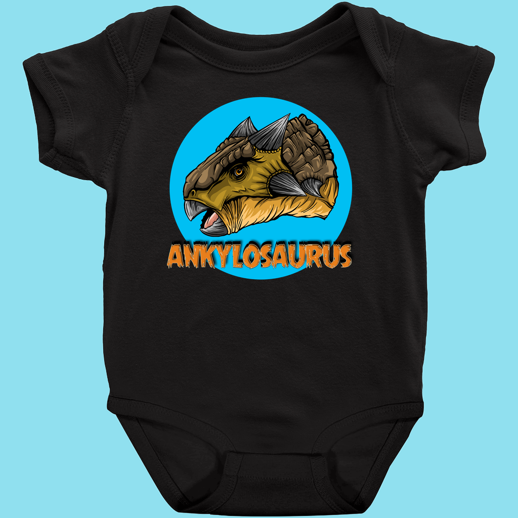 Jurassic Studios Toddler Ankylosaurus Head Onesie is a black baby bodysuit with a colorful Ankylosaurus illustration in a blue circle and “ANKYLOSAURUS” in bold orange letters below.