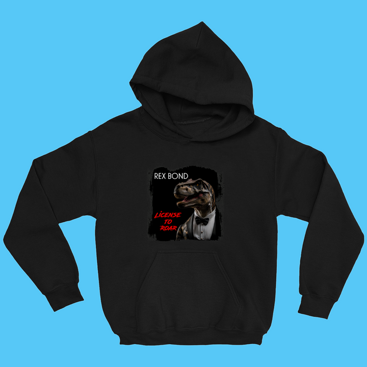 The Kids Rex Bond Hoodie by Jurassic Studio features a T. rex as James Bond and the text REX BOND and LICENSE TO ROAR on the front—an ideal dinosaur fan gift for kids.