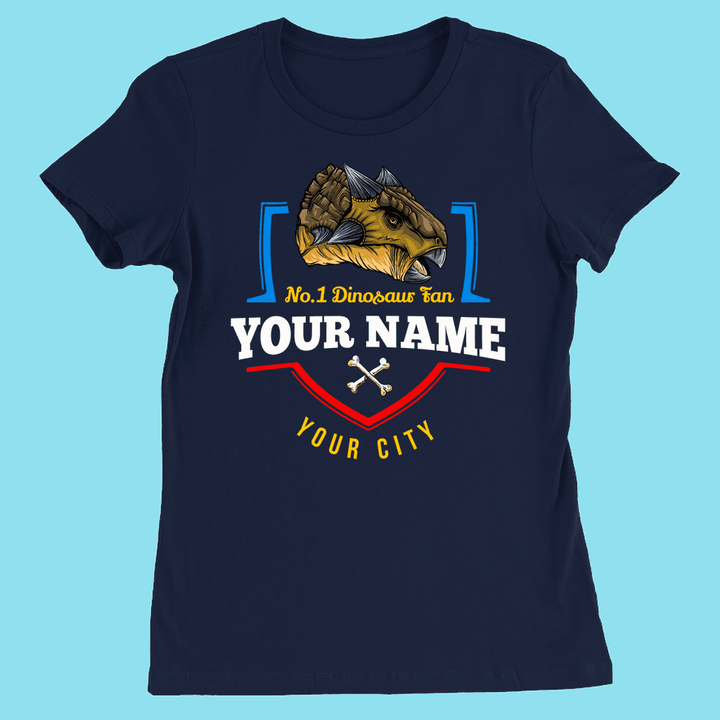 The Jurassic Studio N.1 Ankylosaurus Fan Custom Women T-Shirt in navy blue features a dinosaur head, No.1 Dinosaur Fan text, crossed bones, and editable YOUR NAME and CITY—ideal personalized gift for dino lovers.