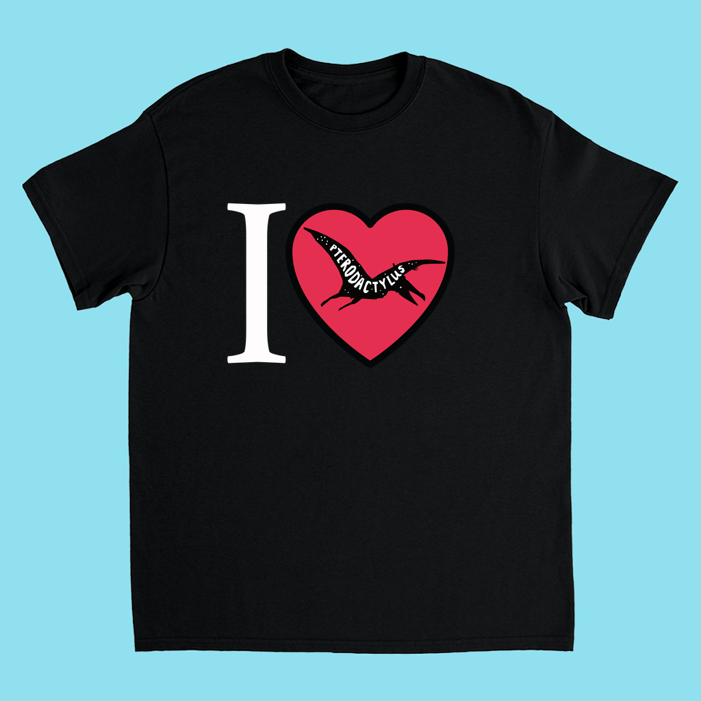 The Kids I Love Pterodactyl T-Shirt by Jurassic Studio features a heart-shaped pterodactyl silhouette and I ♥ PTERODACTYLUS text—ideal for any young dinosaur fan. The light blue background adds a fun, playful touch.