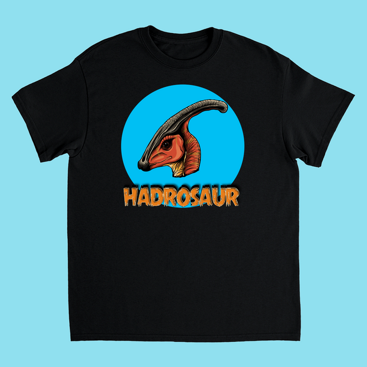 The Kids Hadrosaur Head T-Shirt by Jurassic Studio features a black tee with an illustrated hadrosaur head in a blue circle and HADROSAUR in bold orange letters—perfect for young dinosaur fans.