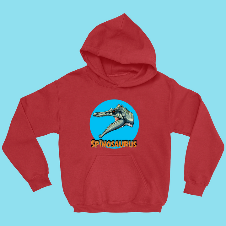 The Kids Spinosaurus Head Hoodie by Jurassic Studio showcases a cartoon Spinosaurus head in a blue circle with bold yellow text, set against a light blue background. This fun dinosaur hoodie is a unique Jurassic Studio exclusive.
