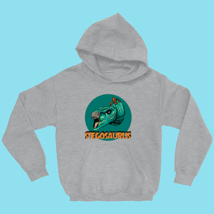 Jurassic Studio’s Kids Stegosaurus Head Hoodie features a gray fabric, vibrant cartoon Stegosaurus head in a green circle, and bold orange “STEGOSAURUS” text—perfect for dino-loving kids!.