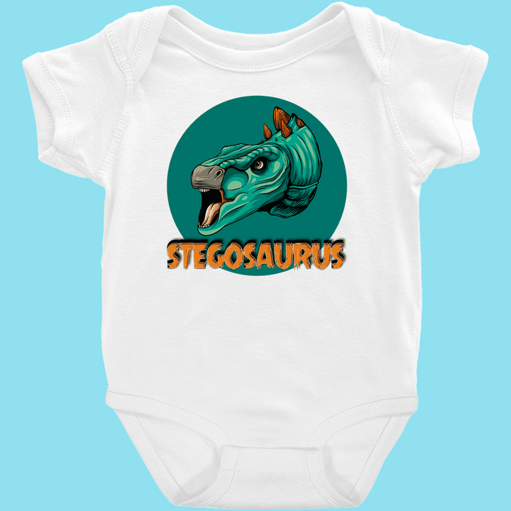 The Jurassic Studio Toddler Stegosaurus Head Onesie features a white design with a vibrant stegosaurus head in a green circle, “STEGOSAURUS” in bold orange letters below, and a light blue background for an adorable look.