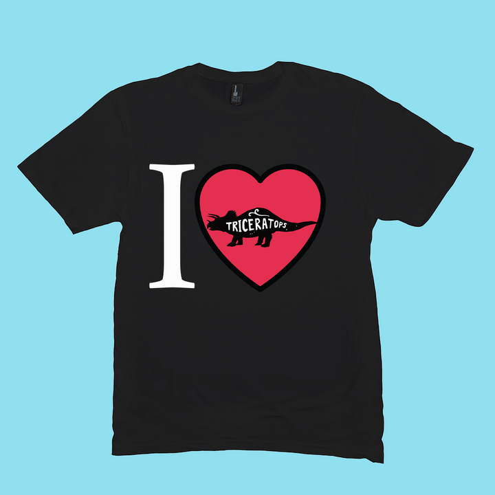 The Men I Love Triceratops T-Shirt by Jurassic Studio features a bold “I ♥” with a triceratops silhouette and “TRICERATOPS” text—perfect for dinosaur fans. Available exclusively from Jurassic Studio on a light blue shirt.