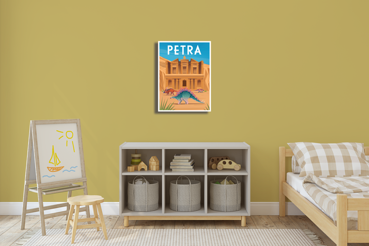 A cozy childrens room with yellow walls, a bed, a small shelf with baskets, an easel with a sun and boat drawing, canvas wall art, and the Petra Canvas Wrap by Jurassic Studio displayed above the shelf.