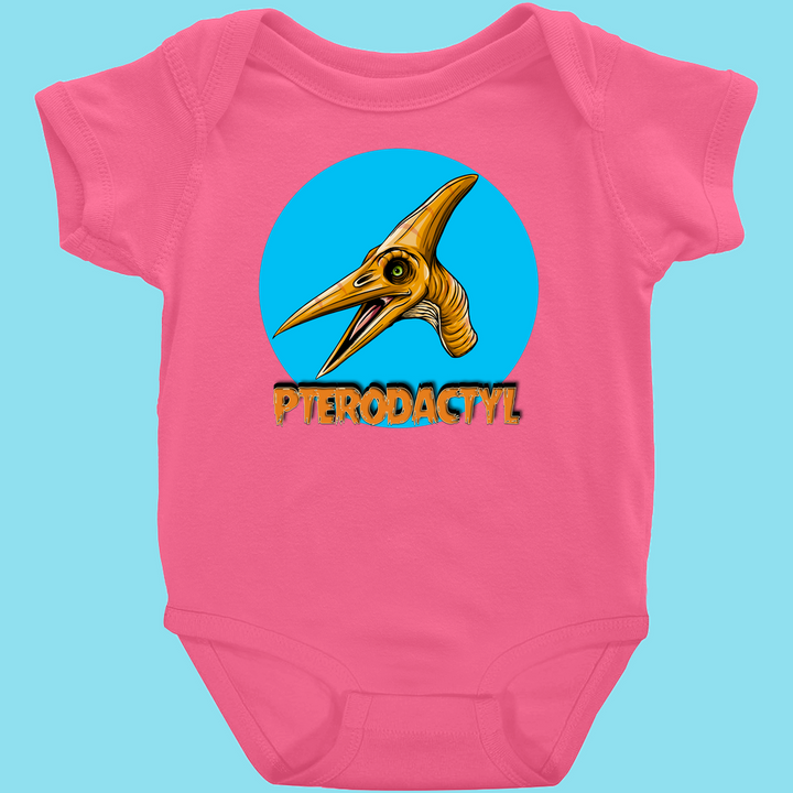The Jurassic Studio Toddler Pterodactyl Head Onesie is a pink baby outfit with a cartoon pterodactyl head in a blue circle and bold yellow PTERODACTYL lettering below.
