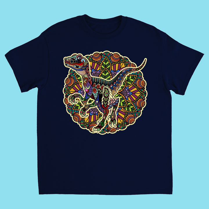 Jurassic Studio’s Kids Velociraptor Mandala T-Shirt in navy blue features a vibrant, intricate mandala dinosaur design—a perfect, colorful gift for young dino fans.