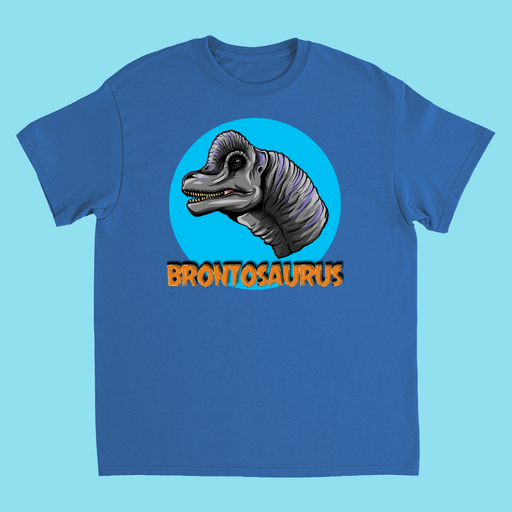 The Kids Brontosaurus Head T-Shirt by Jurassic Studio features a cartoon brontosaurus head in a blue circle with bold orange “BRONTOSAURUS” beneath—perfect for young dinosaur fans or as a unique gift.