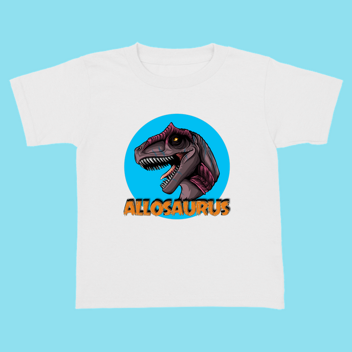 The Jurassic Studio Toddler Allosaurus Head T-Shirt features a cartoon Allosaurus on a blue circle with bold orange ALLOSAURUS below—an ideal gift for little dinosaur fans or toddlers who love Jurassic Studio’s style.