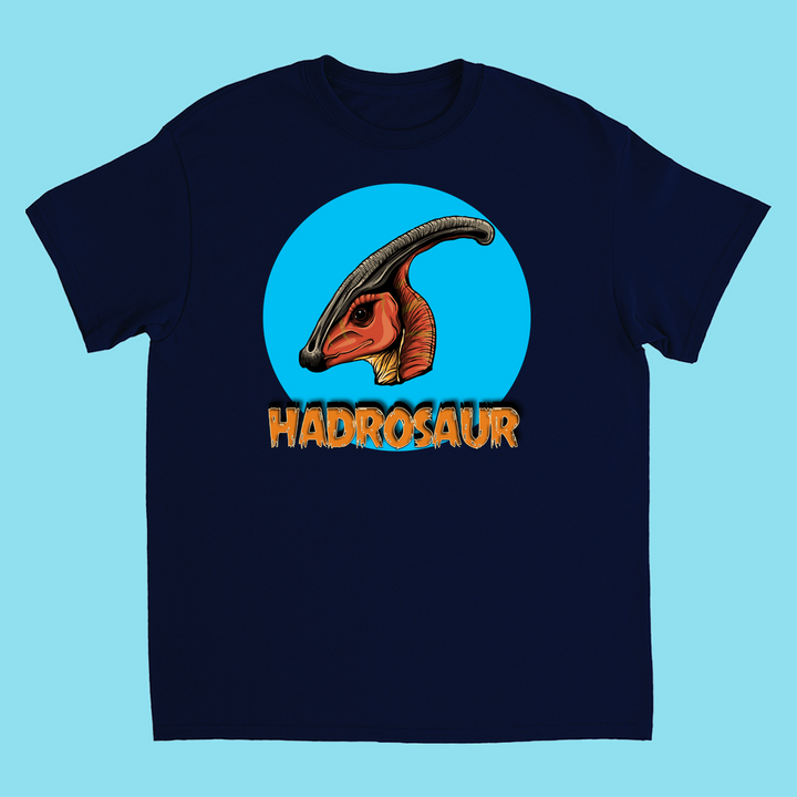 Jurassic Studio’s Kids Hadrosaur Head T-Shirt features a vibrant hadrosaur head in a blue circle with bold orange HADROSAUR text—an ideal gift for dinosaur fans and lovers of Jurassic Studio designs.