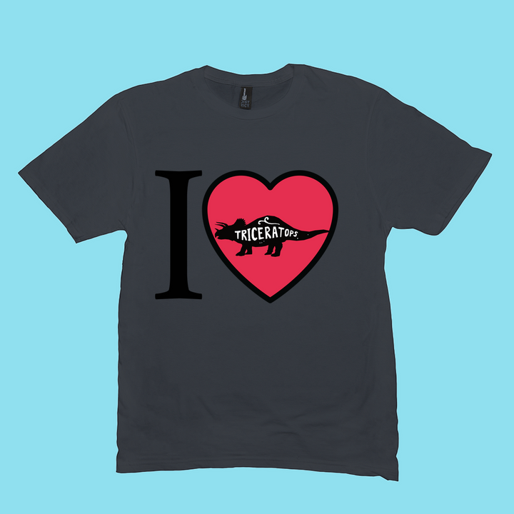 The Jurassic Studio Men I Love Triceratops T-Shirt features a black design with “I ♥ Triceratops” and a triceratops silhouette in the heart—perfect for dinosaur fans. Exclusive, it stands out against a light blue background.