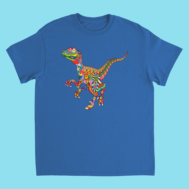 The Kids Velociraptor Zentangle T-Shirt by Jurassic Studio features a psychedelic-style dino graphic with vibrant, swirling patterns on a light blue background—perfect for young dinosaur fans and exclusive to Jurassic Studio.
