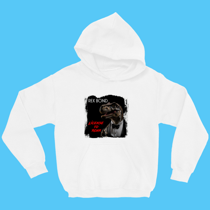 The Kids Rex Bond Hoodie by Jurassic Studio features a dinosaur as James Bond with REX BOND and License To Roar text on a white hoodie—perfect gift for dinosaur fans. Displayed on a blue backdrop.