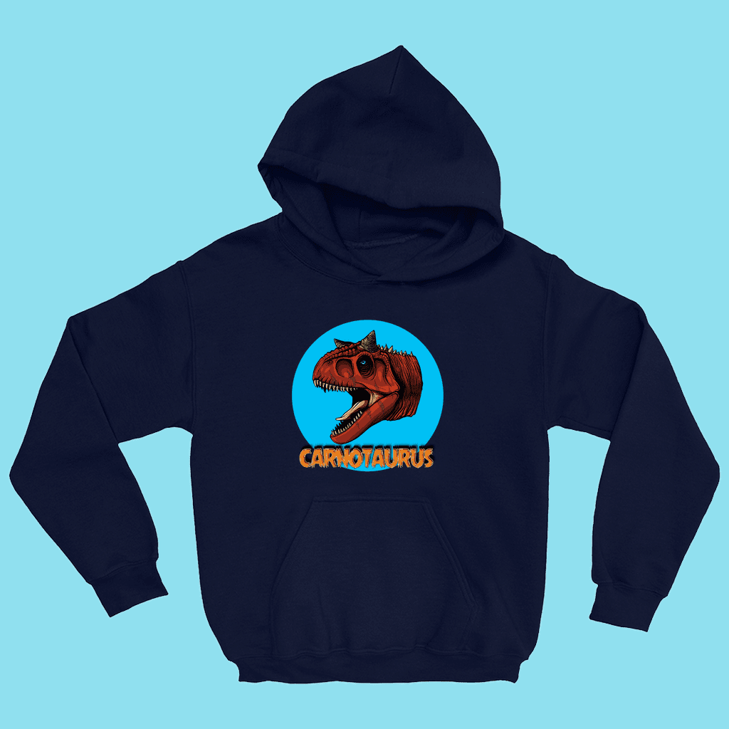 The Jurassic Studio Kids Carnotaurus Head Hoodie features a navy blue design with a roaring dinosaur head in a blue circle and CARNOTAURUS in orange, set against light blue for standout style.