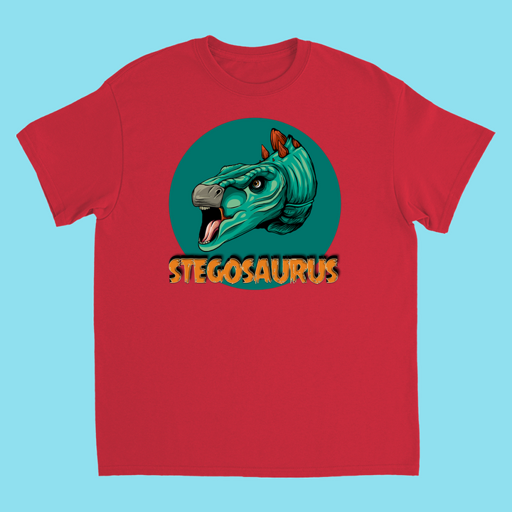 The Jurassic Studio Kids Stegosaurus Head T-Shirt features a cartoon stegosaurus head in a teal circle with bold yellow STEGOSAURUS—a perfect gift for dinosaur fans and exclusive to Jurassic Studio.