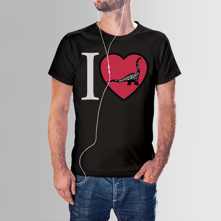 A man wears the Men I Love Brachiosaurus T-Shirt by Jurassic Studio, featuring a black design with a bold white I, a red heart, and sauropod—an exclusive and perfect gift for any dinosaur fan.