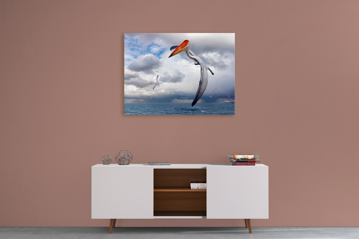 A modern white sideboard stands against a mauve wall, topped with geometric decor and books. Above, Jurassic Studios Azhdarcho Flying Canvas Wrap features a striking seascape with a large bird and leaping fish.