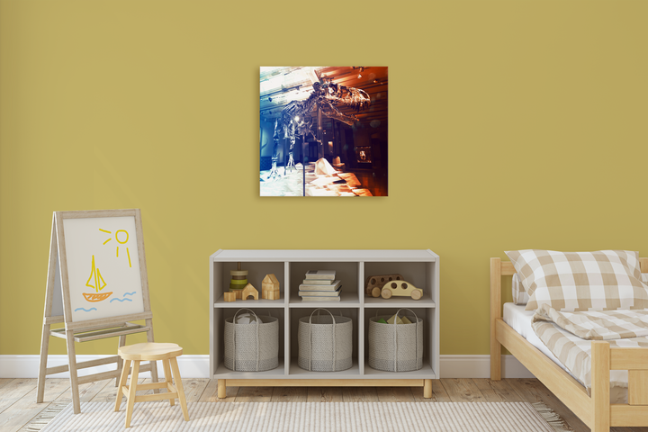 A cozy, tidy children’s room with a small bed, cubby shelf, and an easel; the yellow wall above displays Jurassic Studio’s T-Rex Full Skeleton Canvas Wrap alongside a photo of a sunlit cafe.
