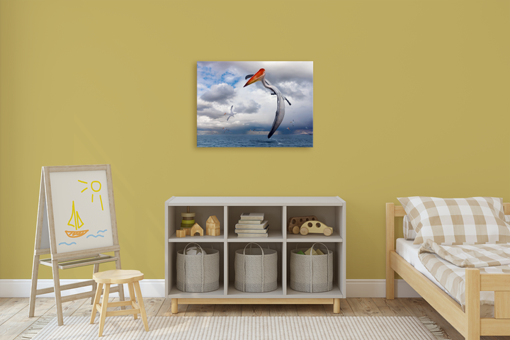 A child’s bedroom with yellow walls, checked bedding, a white storage unit with baskets, a small easel showing a sun and boat drawing, playful dinosaur art by Jurassic Studio, and the Azhdarcho Flying Canvas Wrap above the bed.