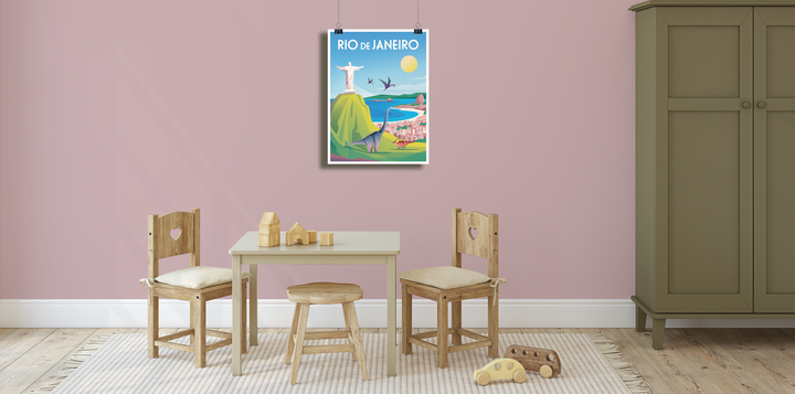 A small childrens playroom features two wooden chairs, a table with toy blocks and car on a rug. Above, a Jurassic Studio Rio de Janeiro Poster and playful dinosaur art hang on the pink wall. An olive green cabinet sits on the right.