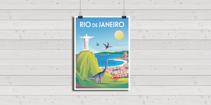 The Rio de Janeiro Poster by Jurassic Studio features the Christ the Redeemer statue, vibrant dinosaurs, flying pterosaurs, blue ocean, and mountains on a colorful canvas against a light wooden wall.