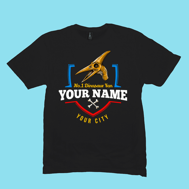 Jurassic Studios N.1 Pterodactyl Fan Custom Men T-Shirt features a yellow pterodactyl, No.1 Dinosaur fan YOUR NAME YOUR CITY, and two white bones on black—exclusive personalized dinosaur design.