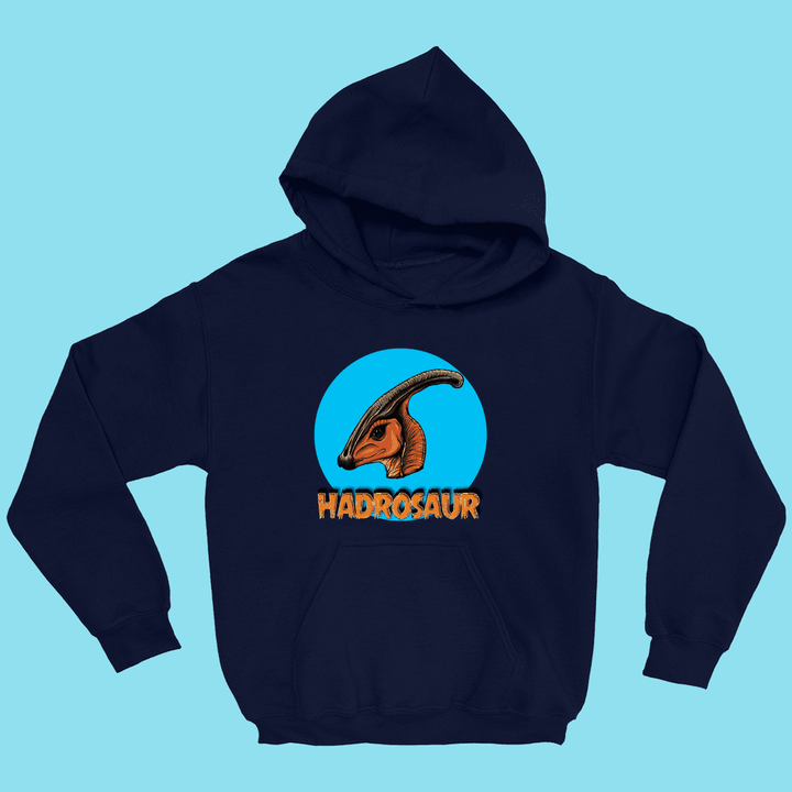 The Jurassic Studio Kids Hadrosaur Head Hoodie features an illustrated orange hadrosaur head inside a blue circle, bold orange “HADROSAUR” text below, and a light blue background—perfect for young dinosaur fans.