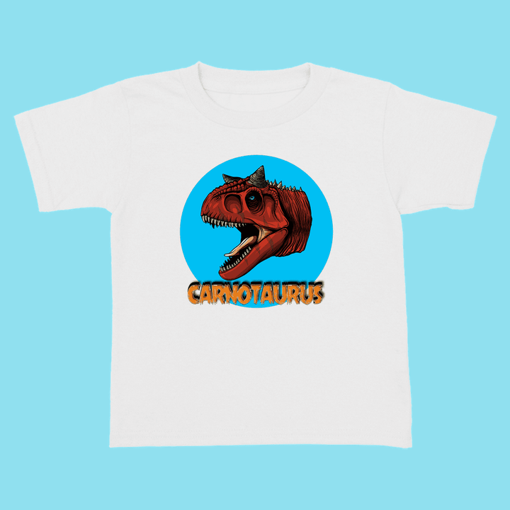 The Jurassic Studio Toddler Carnotaurus Head T-Shirt showcases a cartoon red Carnotaurus inside a blue circle with bold orange CARNOTAURUS text—an exclusive, perfect gift for young dinosaur fans.