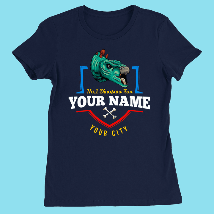 Show your style in the N.1 Stegosaurus Fan Custom Women T-Shirt by Jurassic Studio—a navy blue slim fit featuring a green dinosaur head, No.1 Dinosaur Fan YOUR NAME YOUR CITY, and crossed bones on a light blue background!.