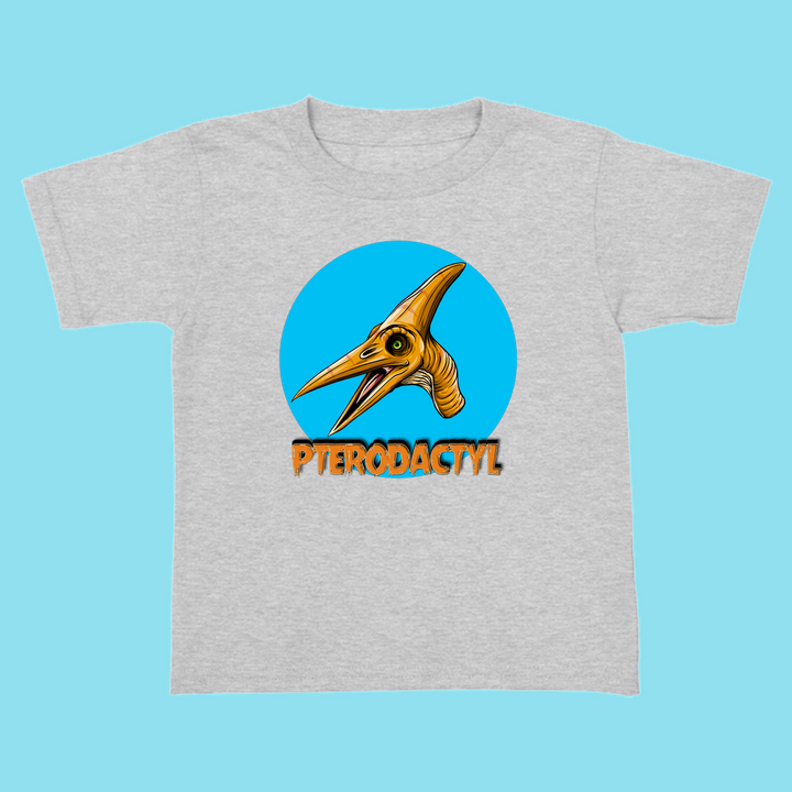 The Jurassic Studio Toddler Pterodactyl Head T-Shirt features a cartoon pterodactyl head in a blue circle with bold orange PTERODACTYL below—an ideal dinosaur fan gift.