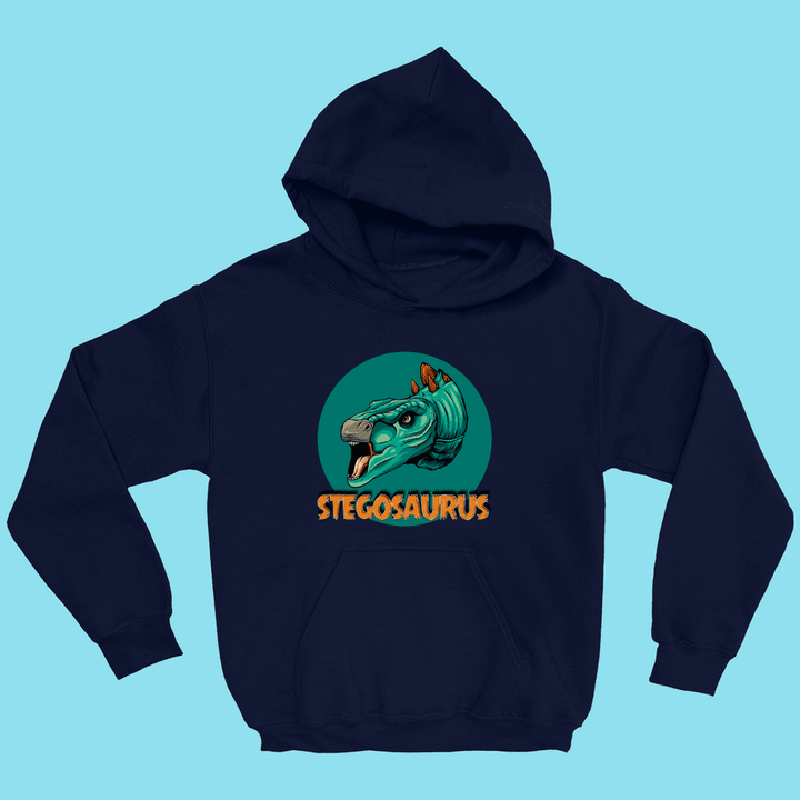 The Kids Stegosaurus Head Hoodie by Jurassic Studio is navy blue and features a cartoon green stegosaurus head with orange plates in a circle, plus STEGOSAURUS in bold orange letters—a fun dinosaur hoodie for kids.