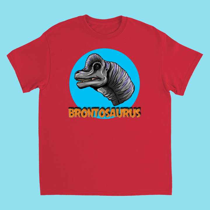 The Kids Brontosaurus Head T-Shirt by Jurassic Studio features a cartoon Brontosaurus head in a blue circle with bold orange BRONTOSAURUS text—a unique gift for any dinosaur fan.