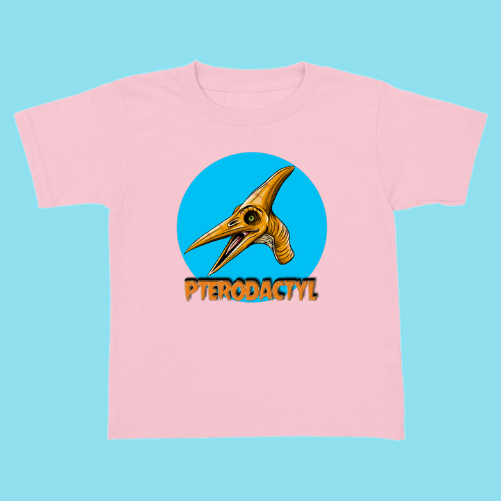 The Toddler Pterodactyl Head T-Shirt by Jurassic Studio features a pink tee with a cartoon pterodactyl in a blue circle and bold orange PTERODACTYL lettering—an ideal gift for dinosaur fans.