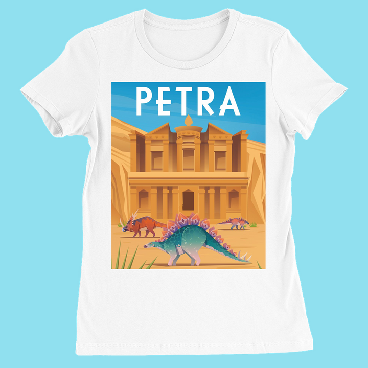 The Women Petra T-Shirt by Jurassic Studio features a slim fit, white design with Petra’s rock-cut facade, three colorful dinosaurs, and PETRA in bold white letters. An exclusive women’s dinosaur tee from Jurassic Studio.