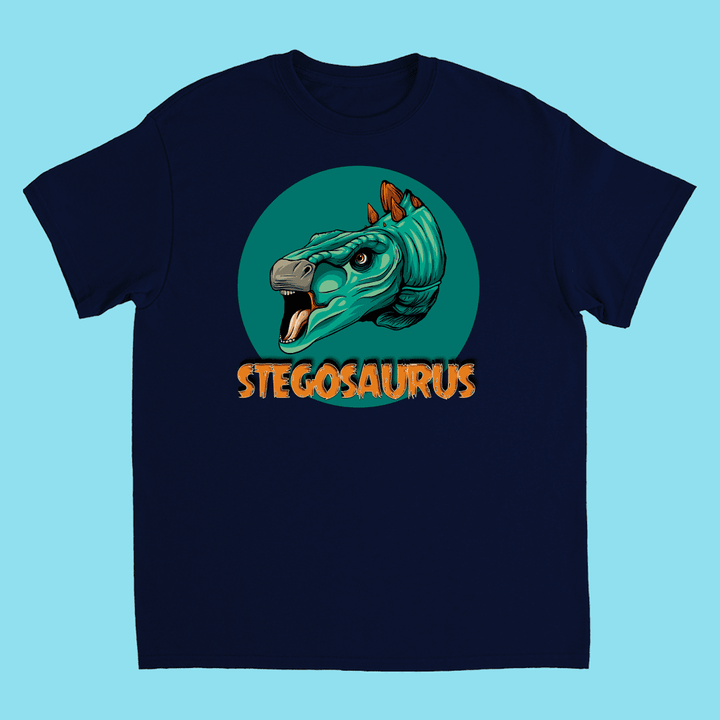 Jurassic Studio’s Kids Stegosaurus Head T-Shirt is navy blue, with a teal cartoon stegosaurus head and orange plates inside a green circle. STEGOSAURUS appears below in bold orange letters—perfect for any dinosaur fan.